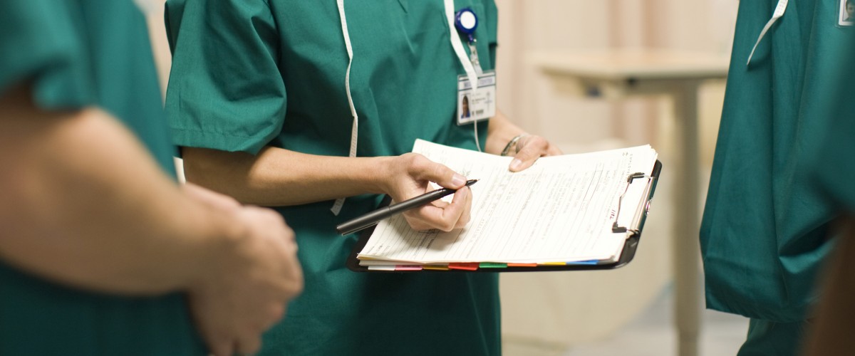 Three surgeons in operating room